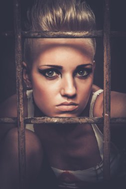 Troubled teenager girl behind bars clipart