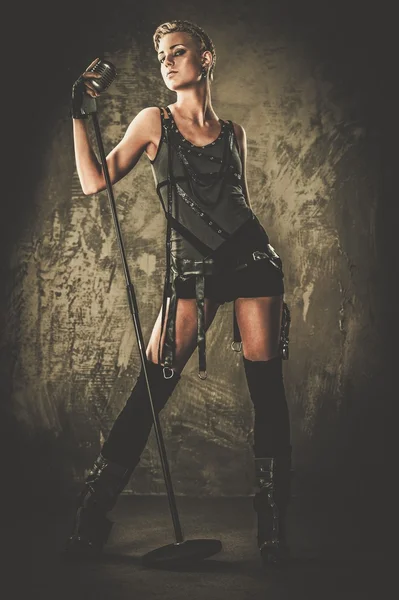 Attractive steampunk singer with microphone — Stock Photo, Image