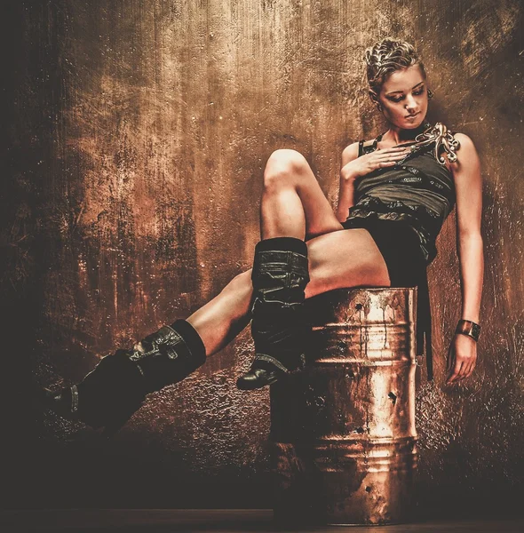 Attractive steampunk girl sitting on barrel — Stock Photo, Image