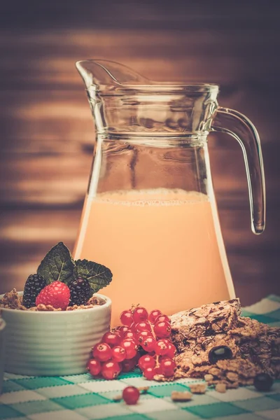 Fresh orange juice in wooden interior — Stock Photo, Image