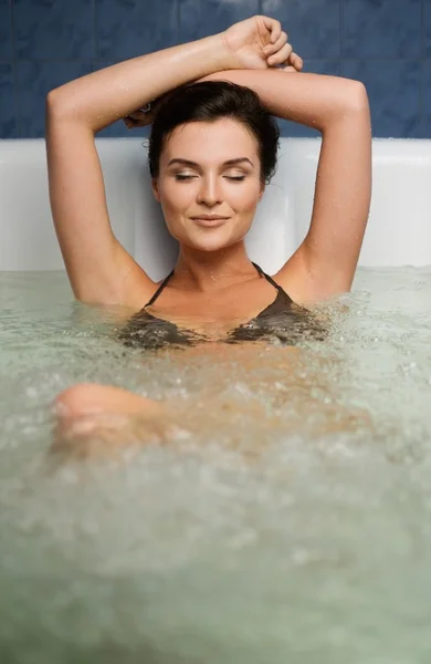 Woman having procedure in a  bathtub — Stock Photo, Image