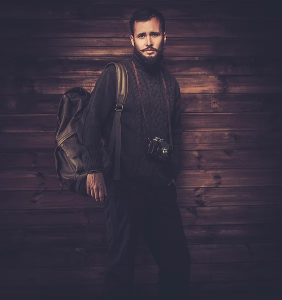 Man wearing cardigan with vintage camera — Stock Photo, Image