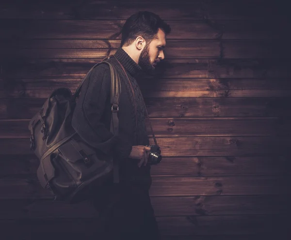 Man wearing cardigan with vintage camera — Stock Photo, Image