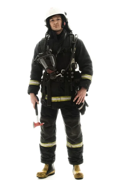 Firefighter with helmet and axe — Stock Photo, Image