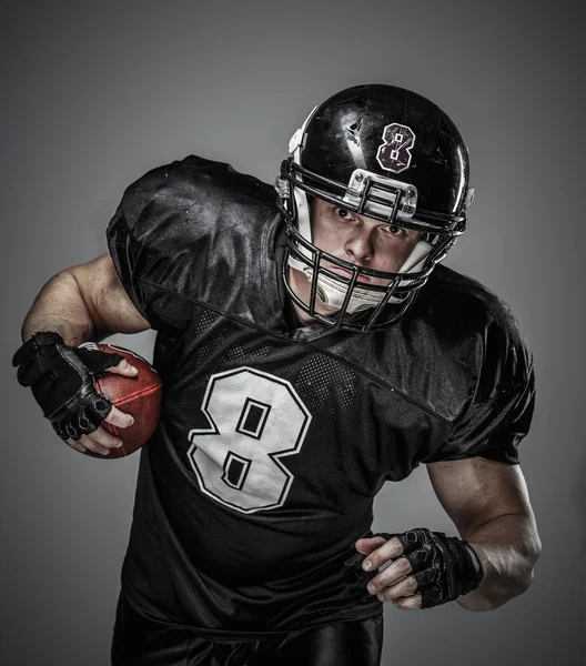 American football player with ball — Stock Photo, Image