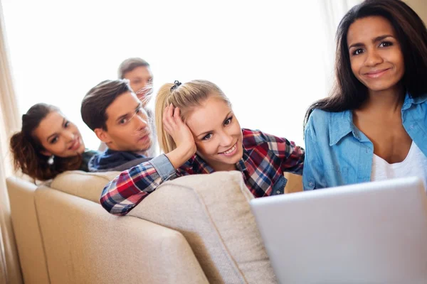 Group of multi ethnic young students preparing for exams in home interior — Stock Photo, Image