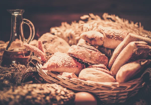 Basket with homemade baked goods on a table — Stock Photo, Image