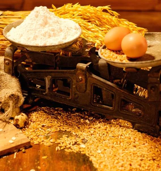 Scales among homemade baked goods on a table — Stock Fotó