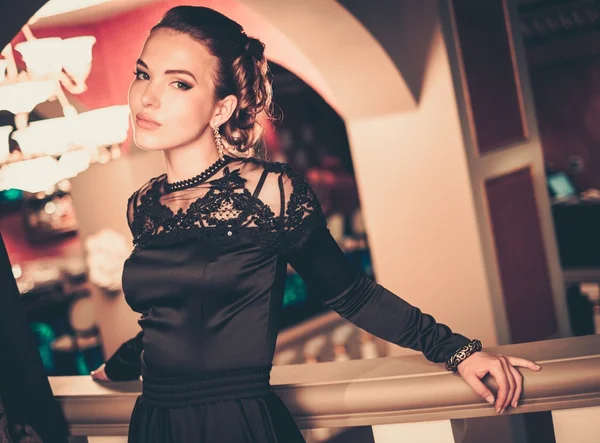 Young woman in evening dress in luxury interior — Stok fotoğraf