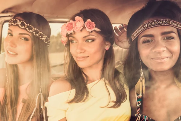 Multinational hippie girls in a van — Stock Photo, Image