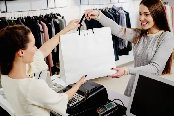 Happy customer with shopping bag Stock Picture