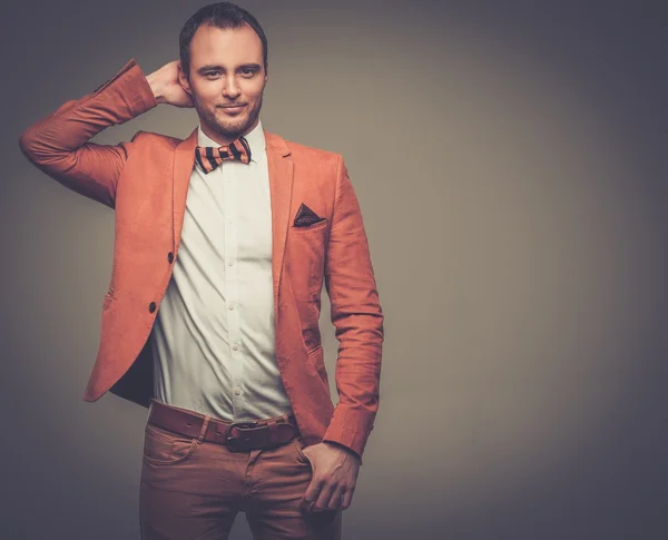 Cheerful sharp dressed fashionist wearing jacket and bow tie — Stock Photo, Image