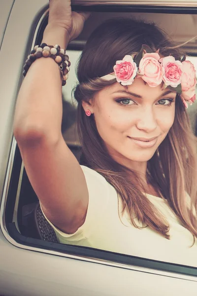 Hippie girl in a van on a road trip — Stock Photo, Image