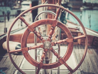 Helm on a vintage wooden yacht  clipart
