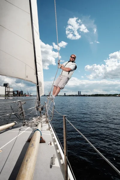 Captain on a yacht during race — Stock Fotó