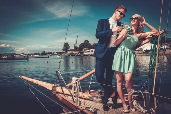 Stylish wealthy couple on yacht — Stock Photo, Image