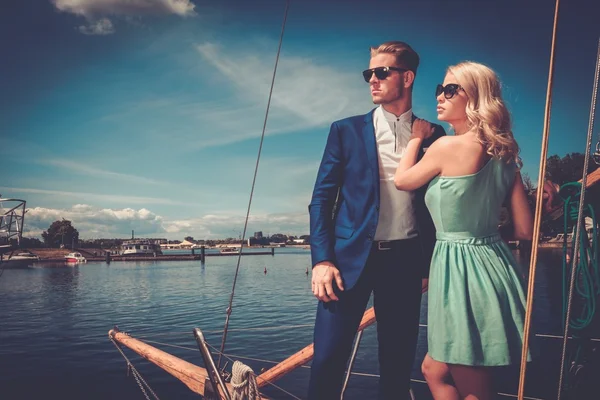 Wealthy couple on a luxury yacht — Stock Photo, Image