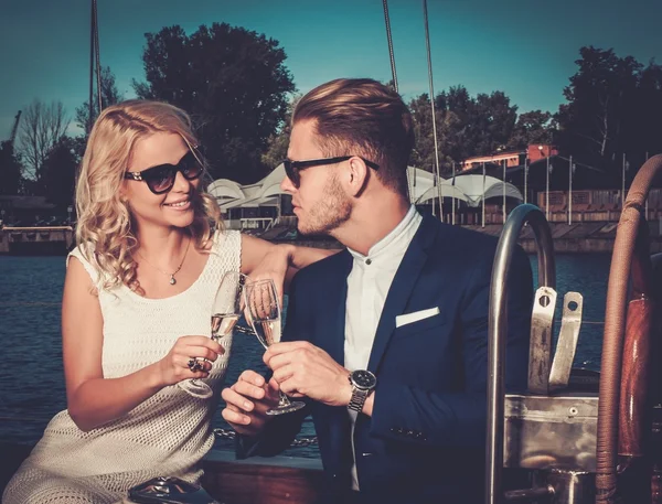 Wealthy couple on a luxury yacht — Stock Photo, Image