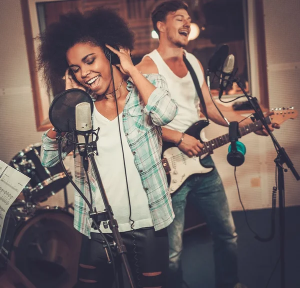 Music band performing in a recording studio — Stock Photo, Image