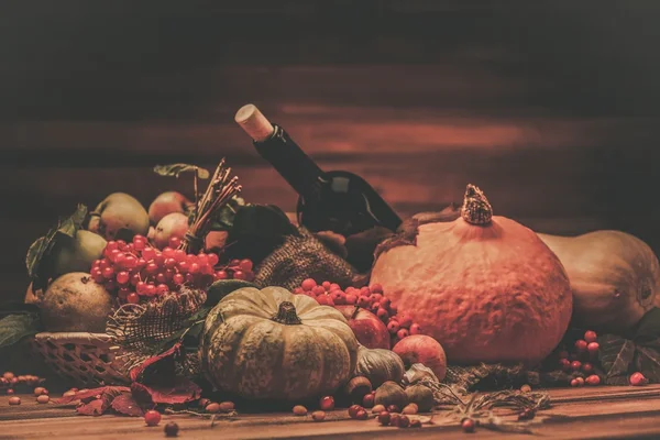 Thanksgiving day autumnal still life with bottle of wine — Stock Photo, Image