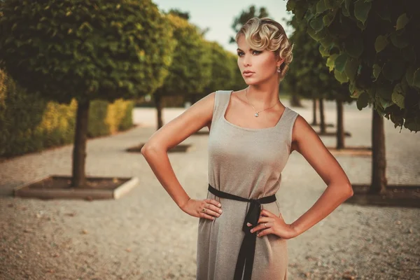 Young lady in a beautiful alley — Stock Photo, Image