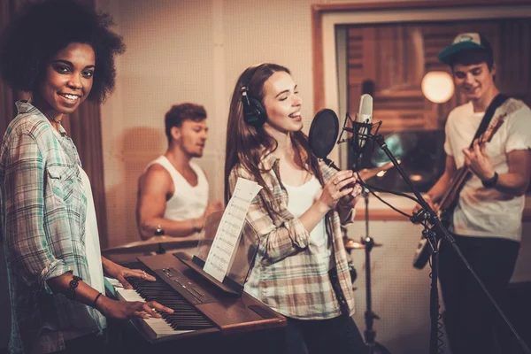 Multiracial music band in a recording studio — Stock Photo, Image
