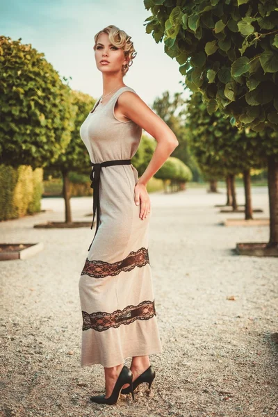 Young lady in a beautiful alley — Stock Photo, Image