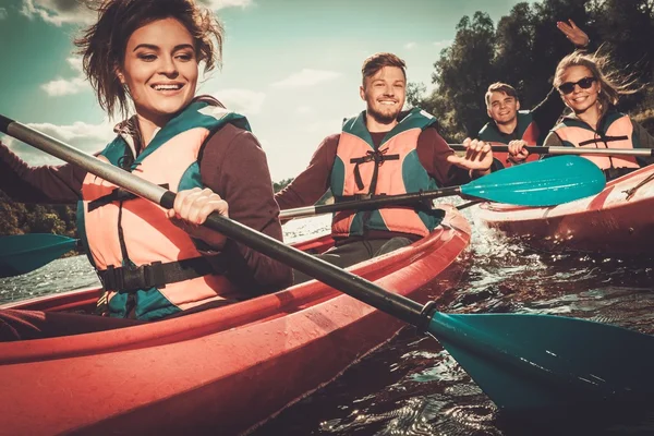 Group of happy people on a kayaks — Stock Photo, Image