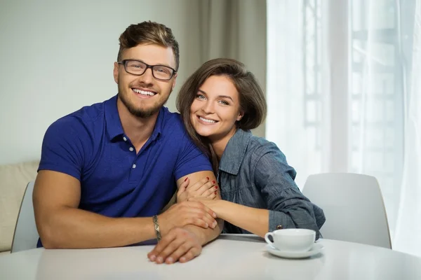 Cheerful couple with tablet pc at home — Stock Photo, Image
