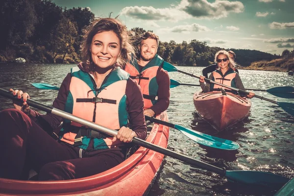 Group of happy people on a kayaks — Stock Photo, Image