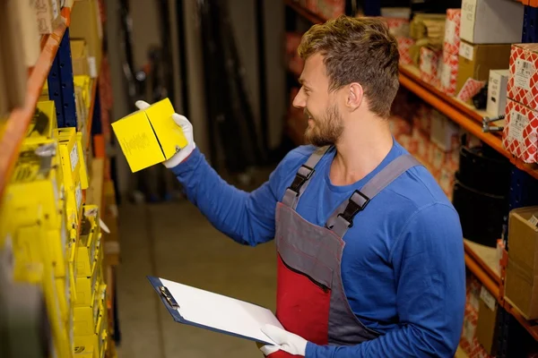 Worker on a automotive spare parts warehouse