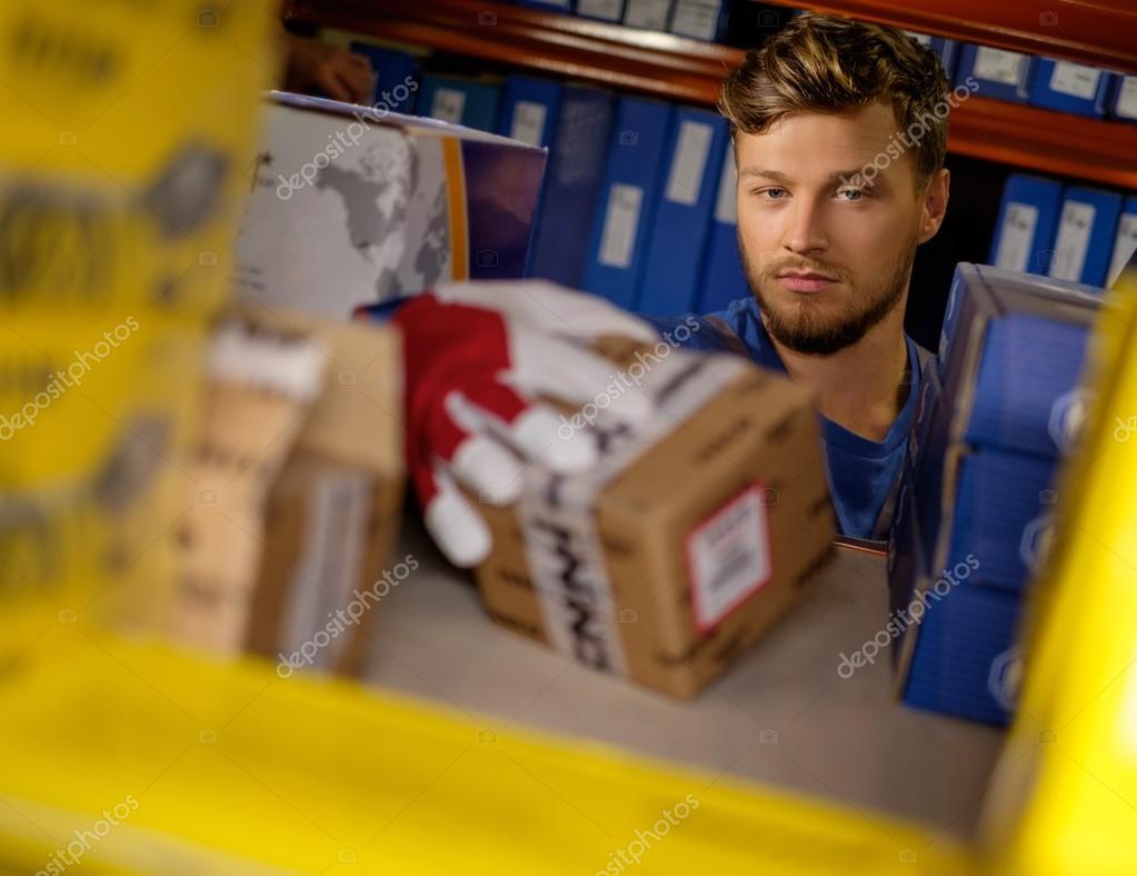 Worker on a automotive spare parts warehouse — Stock Photo © nejron