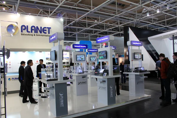 HANNOVER, GERMANY - MARCH 20: The stand of Planet Networking and Communication on March 20, 2015 at CEBIT computer expo, Hannover, Germany. CeBIT is the world's largest computer expo — Stock Photo, Image