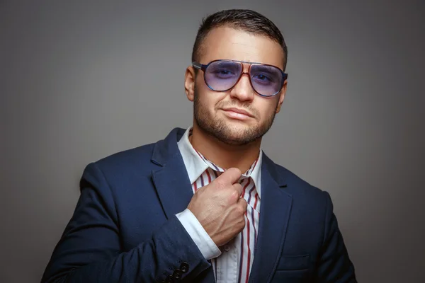 Man in sunglasses and blue suit — Stock Photo, Image
