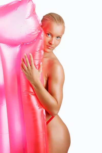 Woman with pink water mattress — Stock Photo, Image