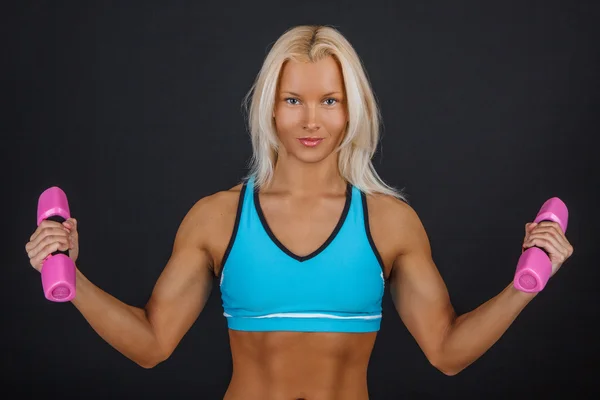 Sporty blond woman with dumbbells — Stock Photo, Image