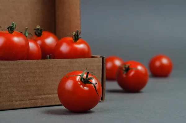 Red tomatoes in the box. — Stock Photo, Image