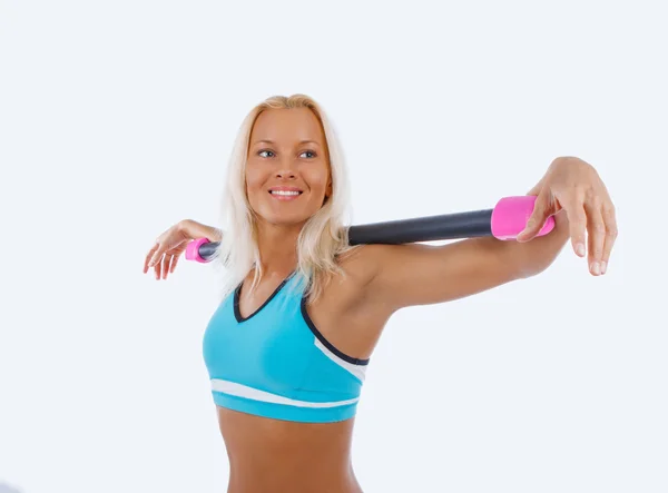 Athletic blond woman doing exercises. — Stock Photo, Image