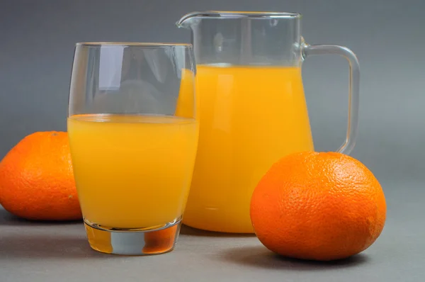 Orange juice and tangerines. — Stock Photo, Image