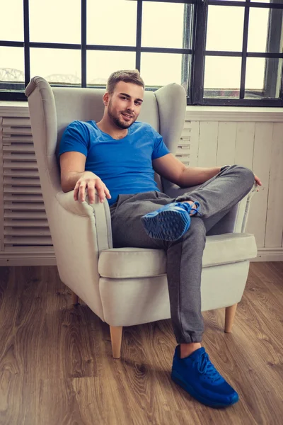 Man relaxing in a chair — Stock Photo, Image