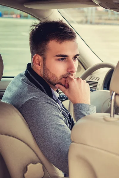 Casual man drives a car — Stock Photo, Image