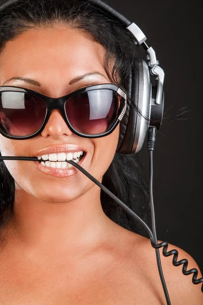 Woman in sunglasses and headphones — Stock Photo, Image
