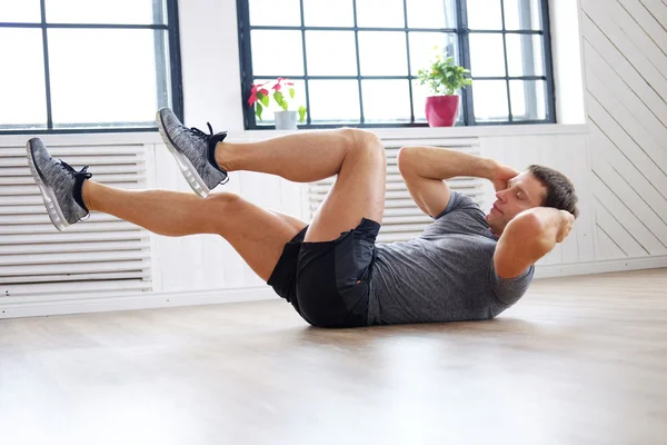 Man doing abs workouts — Stock Photo, Image