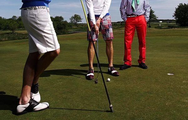 Drie golfspelers — Stockfoto