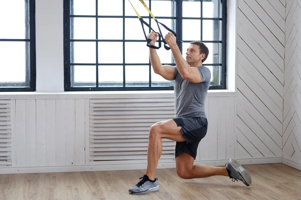 Man exercising with expanders — Stock Photo, Image