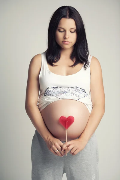 Pregnant brunette woman. — Stock Photo, Image