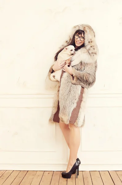 Casual female in a fur coat. — Stock Photo, Image