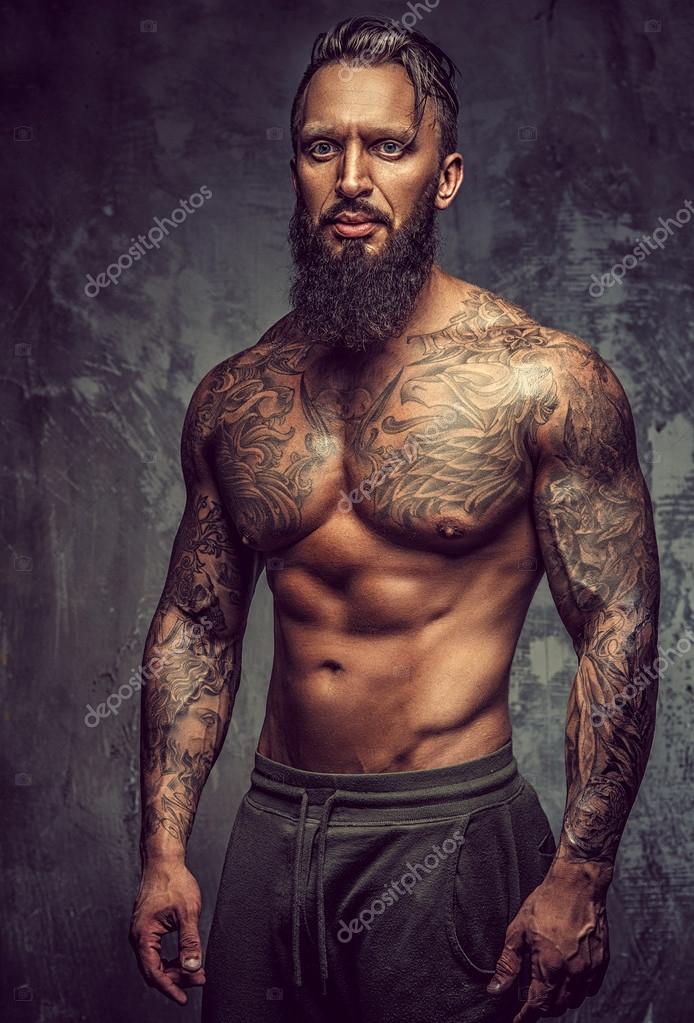 Naked man with tattooed body Stock Photo by ©fxquadro 107561494