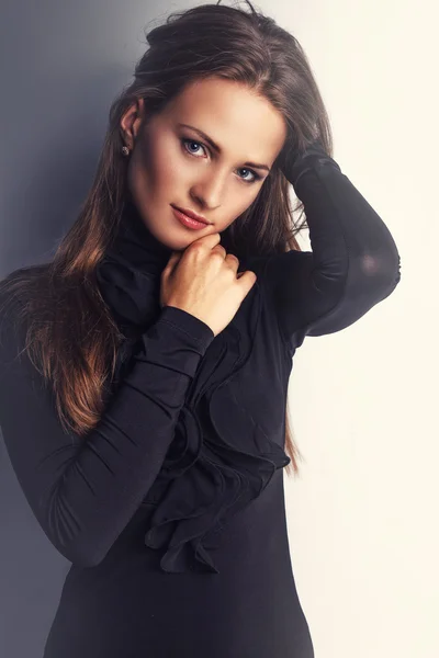 Brunette woman in black clothes. — Stock Photo, Image