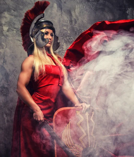 Woman in red fluttering dress — Stock Photo, Image